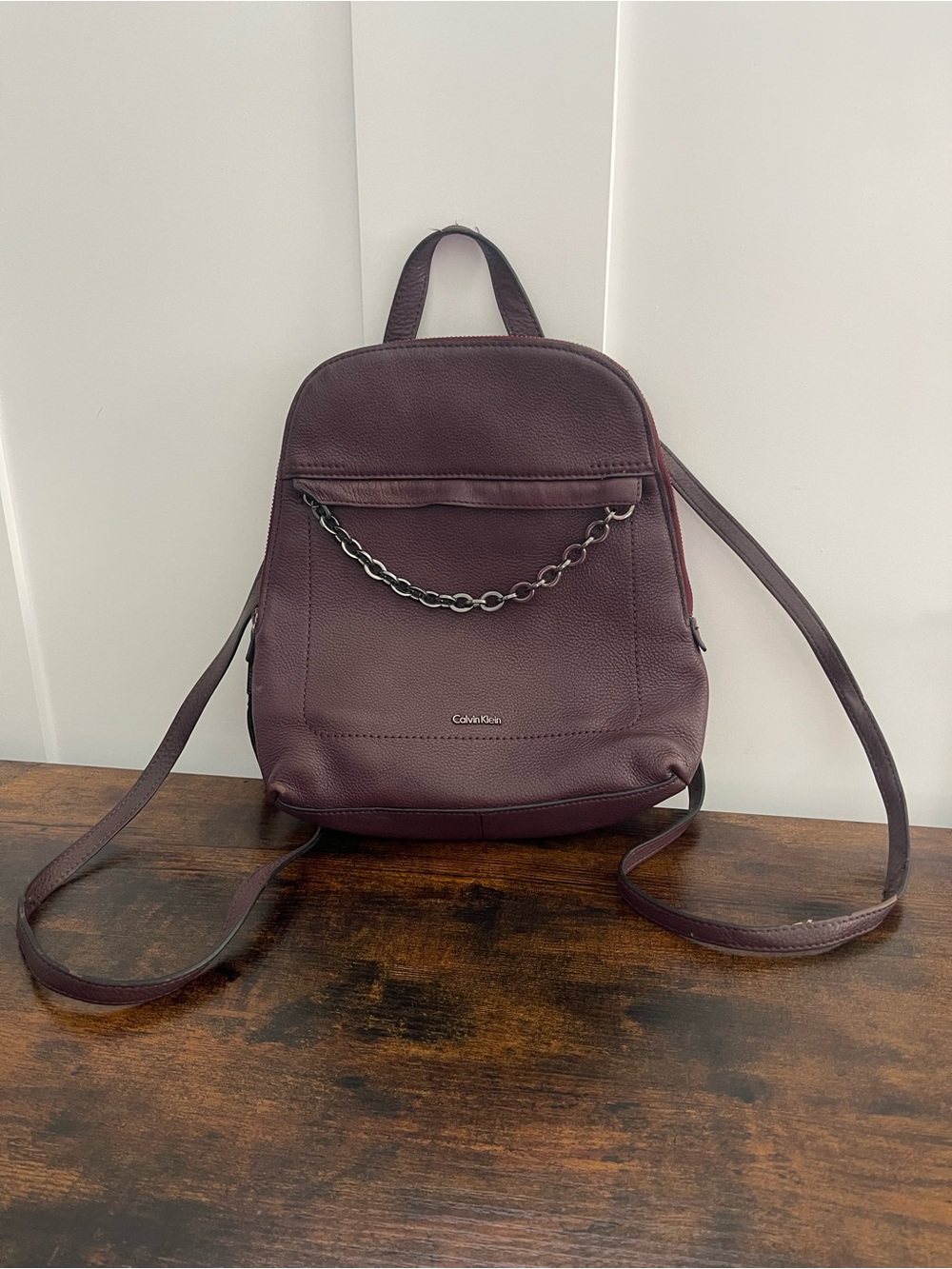 Calvin Klein Deep Plum Pebbled Leather Backpack with Chain Accent